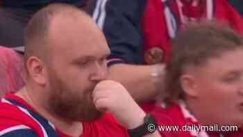 The ONE Norwegian fan refusing to join in with team's viral World Cup celebration! Hilarious moment single supporter sits still as thousands do 'The Viking'
