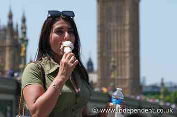 Britons stock up on fans, ice cream and silk scarves as intense heat grips country