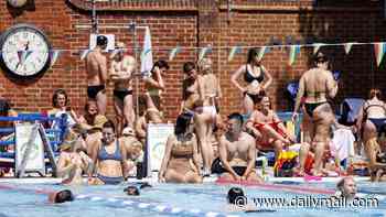 The great British bunk off: Workers and pupils stay home as 40C heatwave looms... but didn't we all cope better in 1976 hot spell?