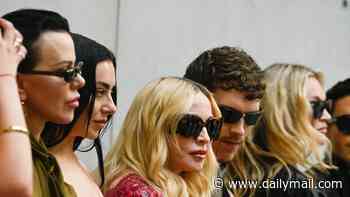 Madonna's longtime pal Debi Mazar looks disgusted by her and Charlie XCX's cigarette smoke at PFW show