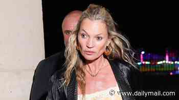 Kate Moss, 52, shows off her supermodel legs in leather hotpants as she's given a helping hand by security while stepping out in Paris