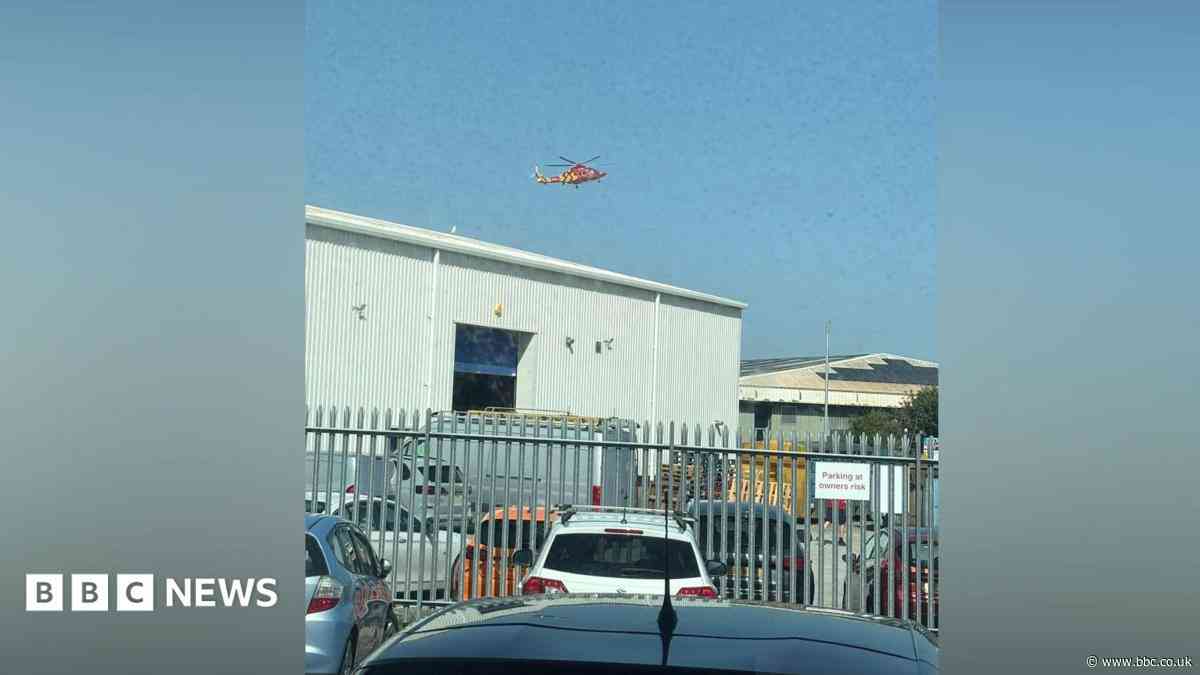 Man trapped by lorry at industrial estate