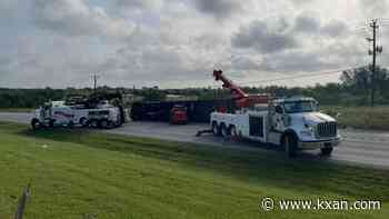PHOTOS: Semi-truck rolls over on US-183