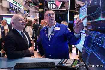 US stocks waver as tech companies slip and oil prices continue falling