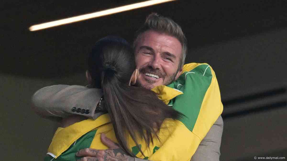David Beckham shares a sweet hug with Cruz's girlfriend Jackie Apostel on a family night out at the Scotland World Cup game as Brooklyn hits them with yet another swipe amid bitter feud
