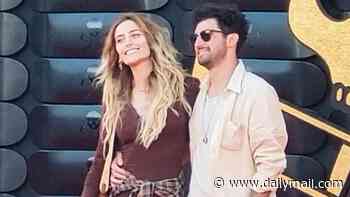 Paris Jackson sparks romance rumours as she puts on a cosy red carpet display with a mystery man at Jackass premiere one year after ending her engagement