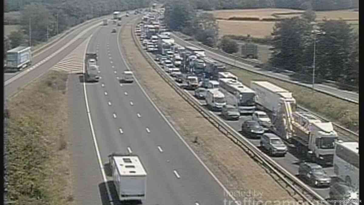Major delays on M56 live after vehicle fire