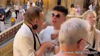 Moment irate Western tourist reprimands deaf Chinese holidaymakers for hogging prime selfie spot at Parisian palace - before fight breaks out