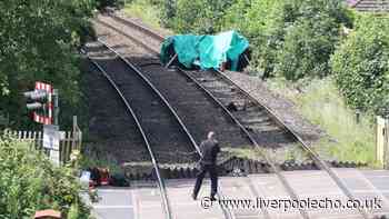 Car flips on Lancashire train tracks as man dies and child fighting for life