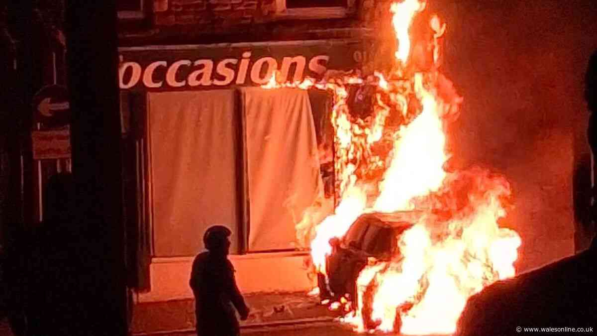 Shop ruined after car explodes and rolls into it