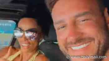 Katie Price reunites with husband Lee Andrews as they dance in his car together - as star shows no sign of grilling the businessman for answers following his prison stint