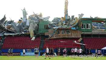 Demolition 'goes wrong' at stadium hosting World Cup team - forcing stunned players to practice in front of a mangled stand