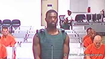 NFL star, 23, who could face life in jail appears in court in anti-suicide vest after surrendering to police