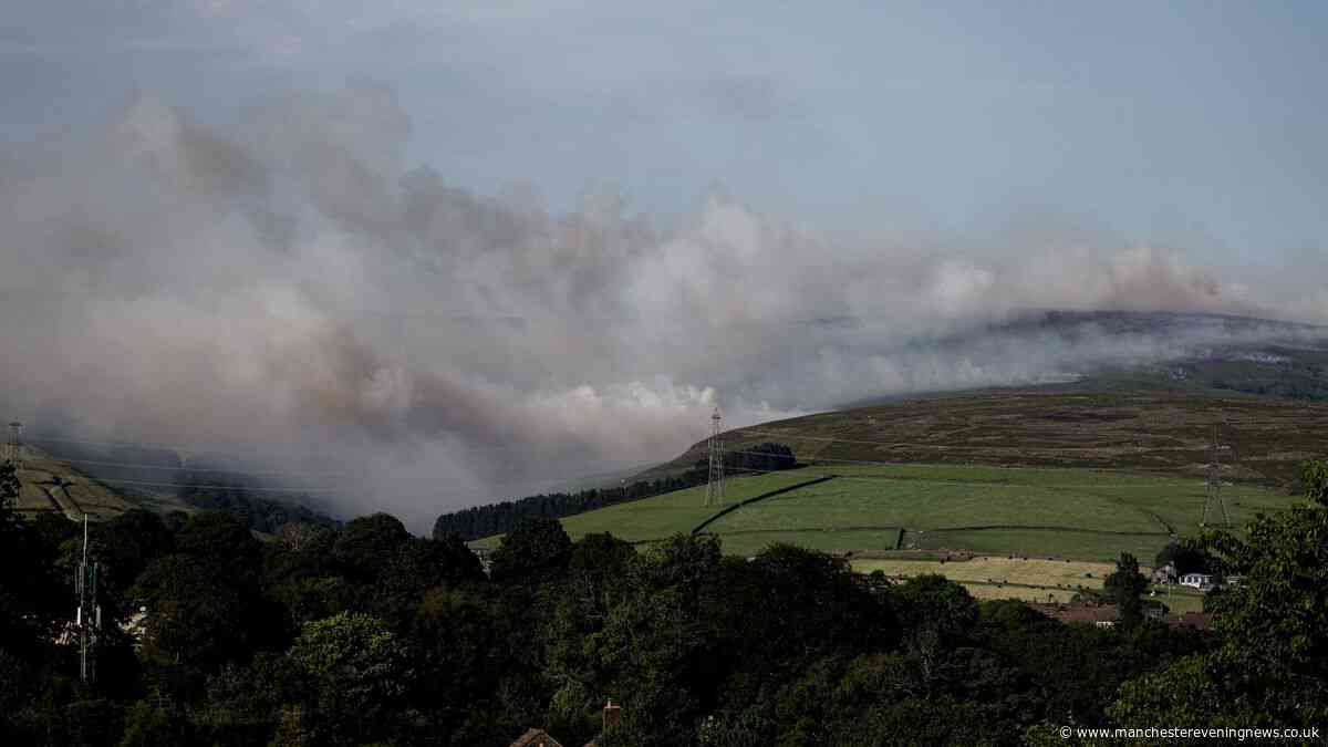 Ash falls over Greater Manchester and smoke clouds smother region as moorland fire rages on for 24 hours