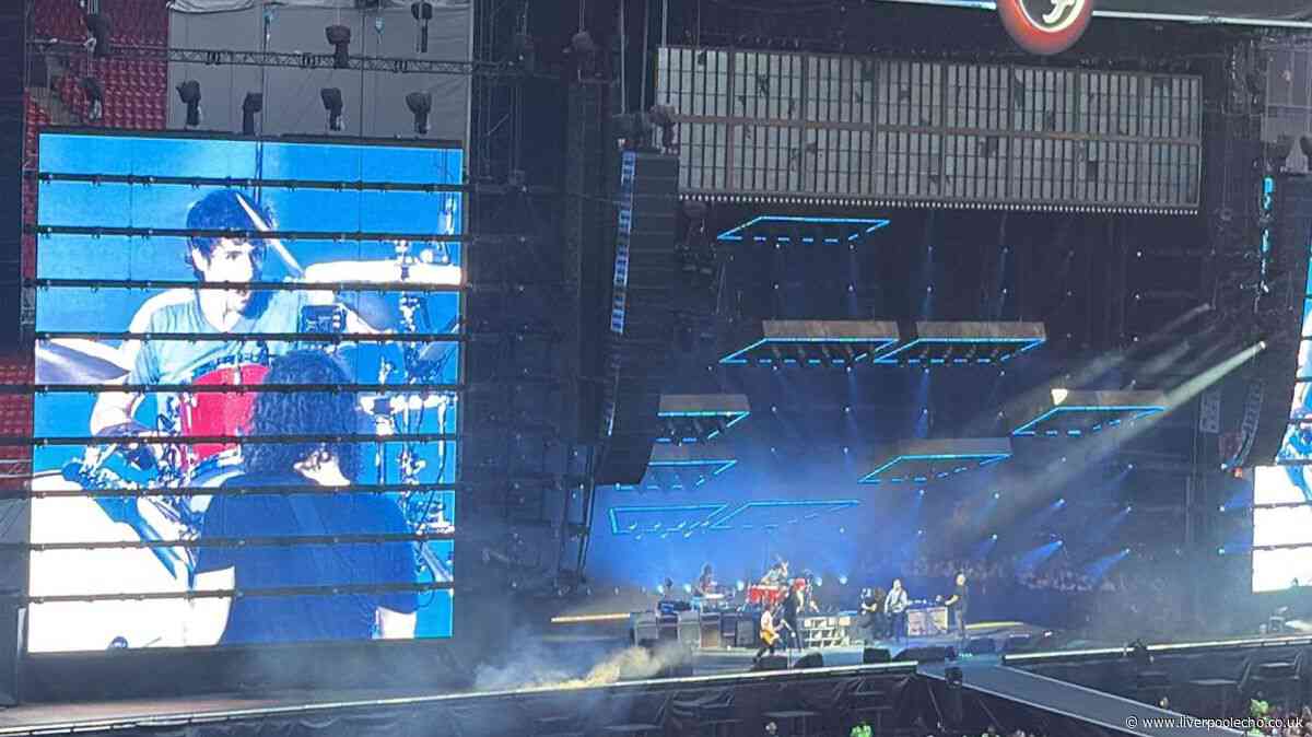 Foo Fighters bring man onstage after sign spotted at Anfield show