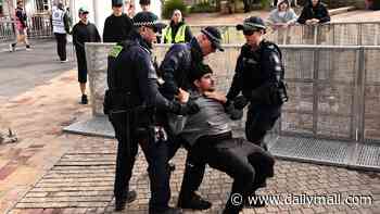 Australia vs Paraguay LIVE: Chaos erupts at Federation Square with a fan dragged out by police as the Socceroos go to half-time 0-0 in nail-biting World Cup clash