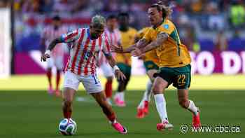 Australians reach World Cup knockout round after goalless draw with Paraguay