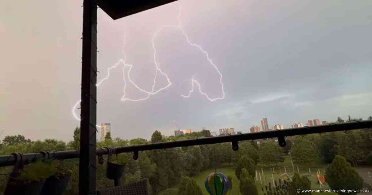Incredible images as Greater Manchester wakes up to thunder and lightning with weather warning still in place