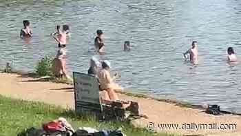 UK is set for third hottest June day ever in a row: Tempers fray in heat as Hampstead Heath swimmers defy rules and threaten staff 