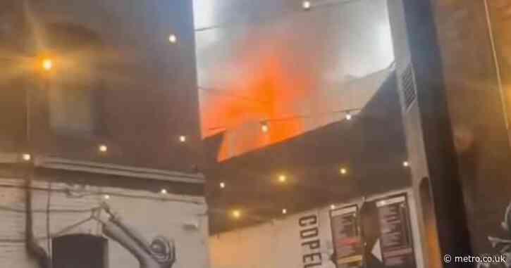 London department store engulfed in flames sending thick black smoke in the air