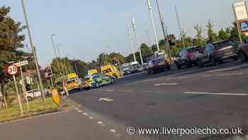Two injured after ambulance and car crash on Queens Drive