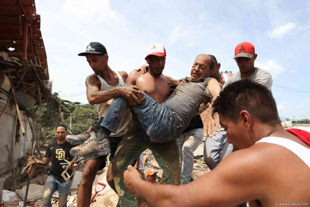 Neighbors dig through Venezuela rubble to search for loved ones as death toll climbs
