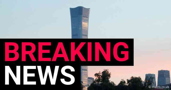 Plane crashes into Beijing’s tallest skyscraper the China Zun with wreckage plummeting to the ground