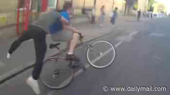 Moment plain clothes police officer puts in hefty rugby tackle to stop fugitive fleeing arrest on his bike as he is hailed a 'proper copper'