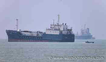 Iran moves to control commercial shipping in Strait of Hormuz, issues warning after vessel is struck