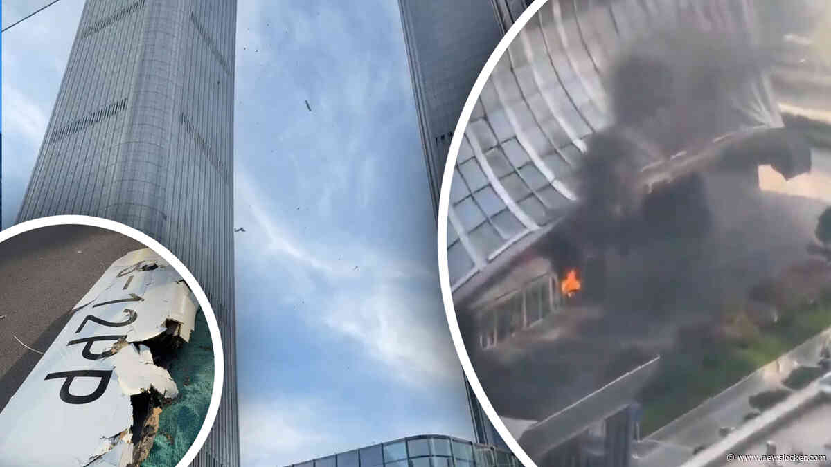 Beelden: vliegtuig stort neer op hoogste wolkenkrabber van Beijing