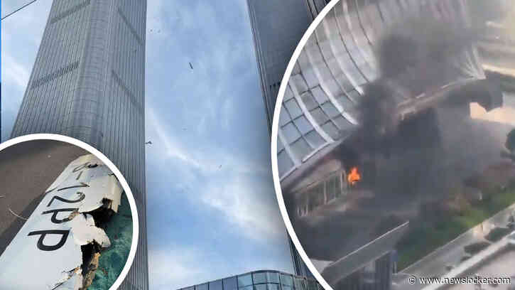 Beelden: vliegtuig stort neer op hoogste wolkenkrabber van Beijing