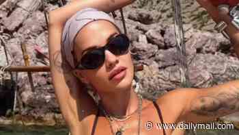 Rita Ora shows off her figure as she poses in skimpy bikinis during sun-soaked trip to Greece
