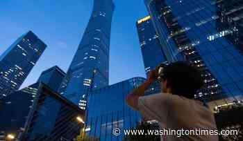 Small aircraft crashes into Beijing's tallest building, according to flight tracking service