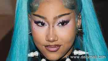 Kim Kardashian's daughter North West, 13, rocks her edgy blue hair and a quirky pointed choker as she attends the Vetements show during Men's Paris Fashion Week