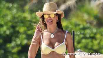 Alessandra Ambrosio, 45, looks tanned and toned in TINY bikini as she sports rumored engagement ring to the beach in Miami