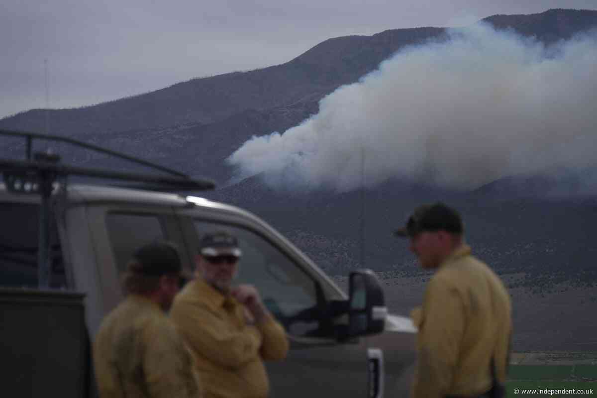 Fast-moving wildfire spreads through western US as restrictions put in place