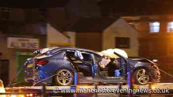 Two people rushed to hospital following smash between car and police vehicle in Rochdale