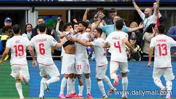 IAN HERBERT: The US and vast Iranian diaspora may be at war with this team, but Iran are winning friends and respect at the World Cup - yes, they're cohering with their Islamic dictatorship but they're just footballers