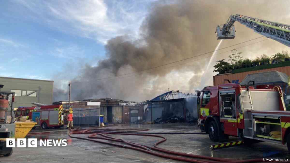 Firefighters battle large warehouse blaze
