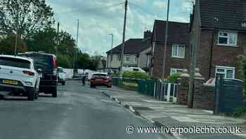 Kirkby road cordoned off LIVE as police 'put up white tent'