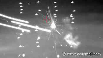 Astonishing moment South Korea blasts drone swarm out of the sky in military drill - before finishing them off with a laser cannon