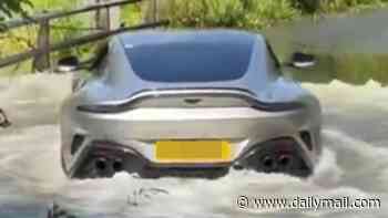 The name's Pond...James Pond! Proud owner of new £165,000 Aston Martin Vantage gets more than he bargained for when he tried to ford river