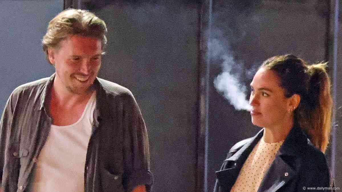 Vaping Lily James falls for a new man - and even a stumble off the pavement can't kerb her enthusiasm