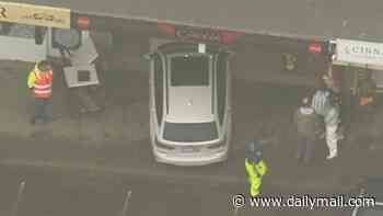 Boy, seven, rushed to hospital after car smashed through chicken shop and ploughed into table where he was eating