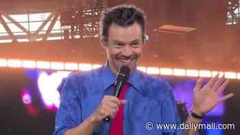 Newly engaged Harry Styles plays matchmaker with fans as he returns to Wembley stage after sparking concern over heatwave collapse