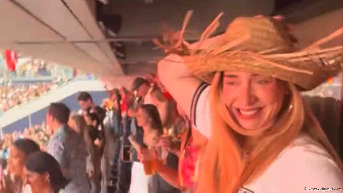 Adele steals fan's hat and shows off her dance moves in an England shirt as she enjoys wild night with Rich Paul at Bad Bunny's star-studded London gig