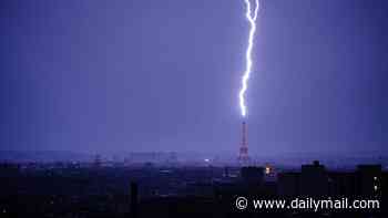 Moment lightning strikes Eiffel Tower as thunderstorms hit France following heatwave