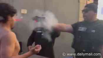 Shocking moment sports bar security guard is arrested for firing Taser gun point blank at patron's head