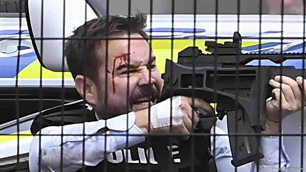 Line of Duty's Martin Compston and Vicky McClure are armed with huge guns in dramatic crash scenes as work on series seven resumes after filming was paused due to Belfast riots
