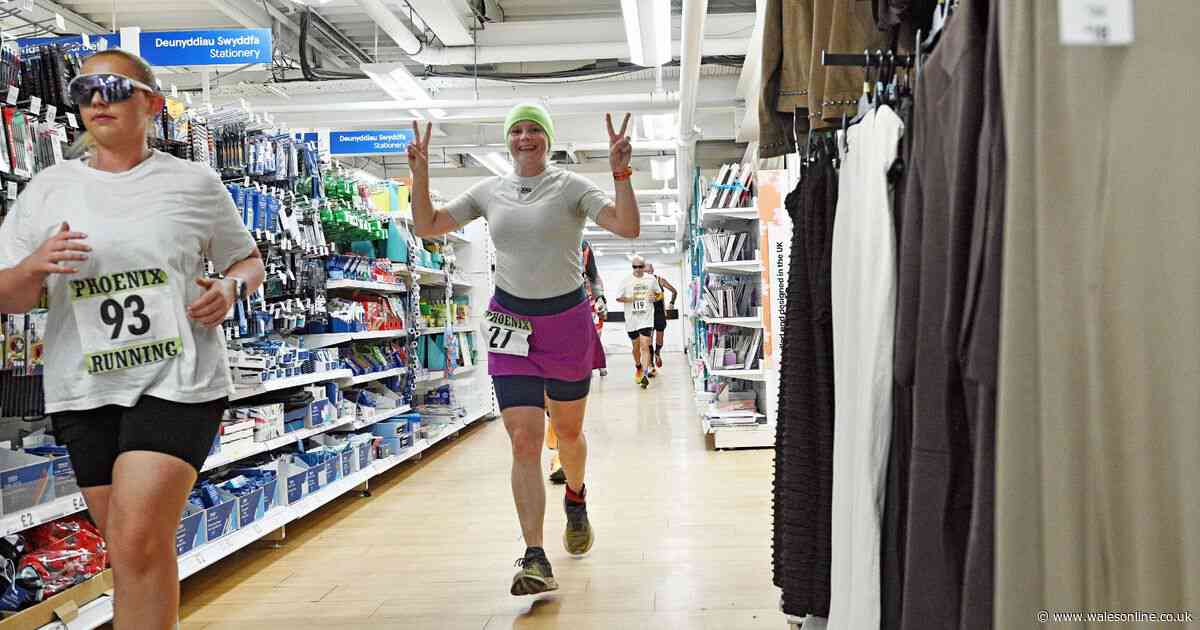 People in fancy dress run through supermarket aisles in marathon in a Tesco